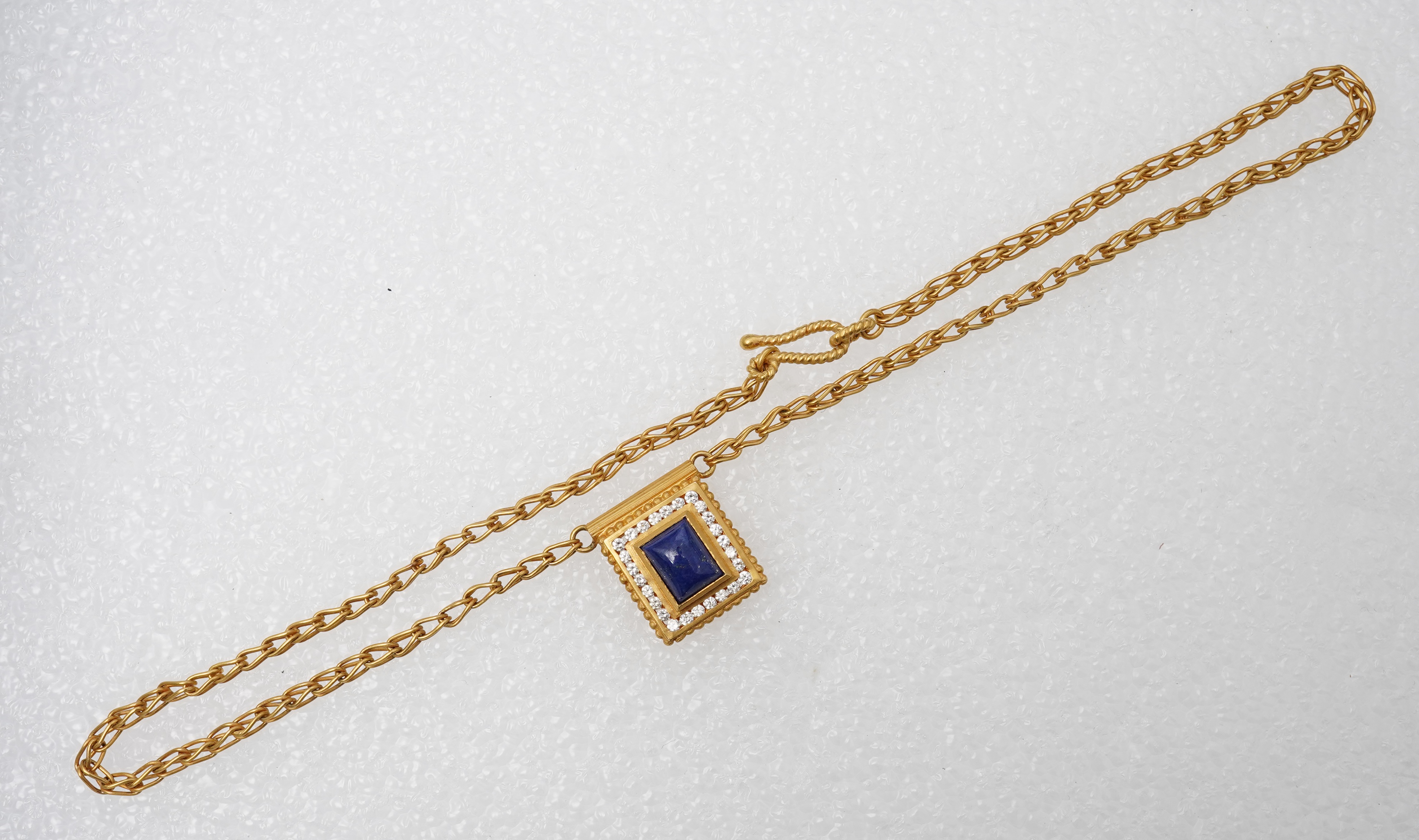 A lapis lazuli, gold and diamond demi-parure